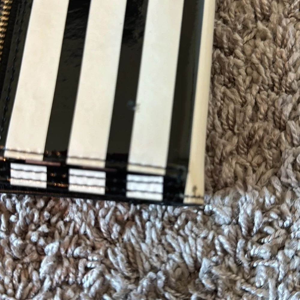 Striped black and white, shiny Kate Spade card wallet